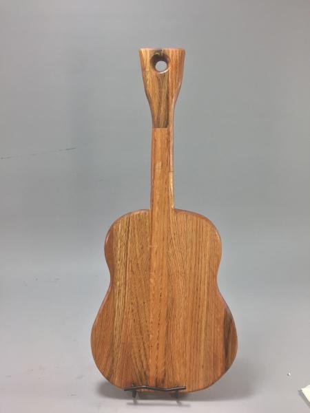 Jam out with this unique guitar-shaped cutting board. 